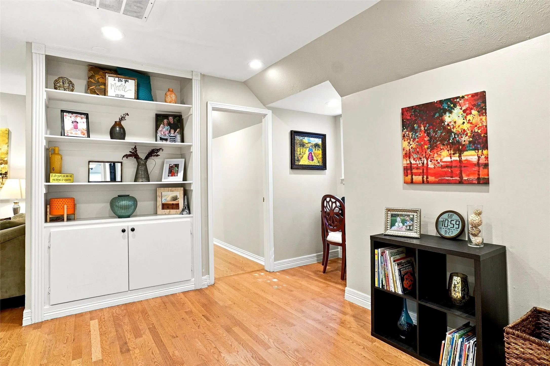 This is the upstairs game room. Beautiful built-in shelving and cabinets and a little office niche... seen on the right... help make this room special.  The dimensions are a bit off under that section because this  is not a square or rectangle room. it wraps around the corner. The LED recessed lights were added throughout the home.