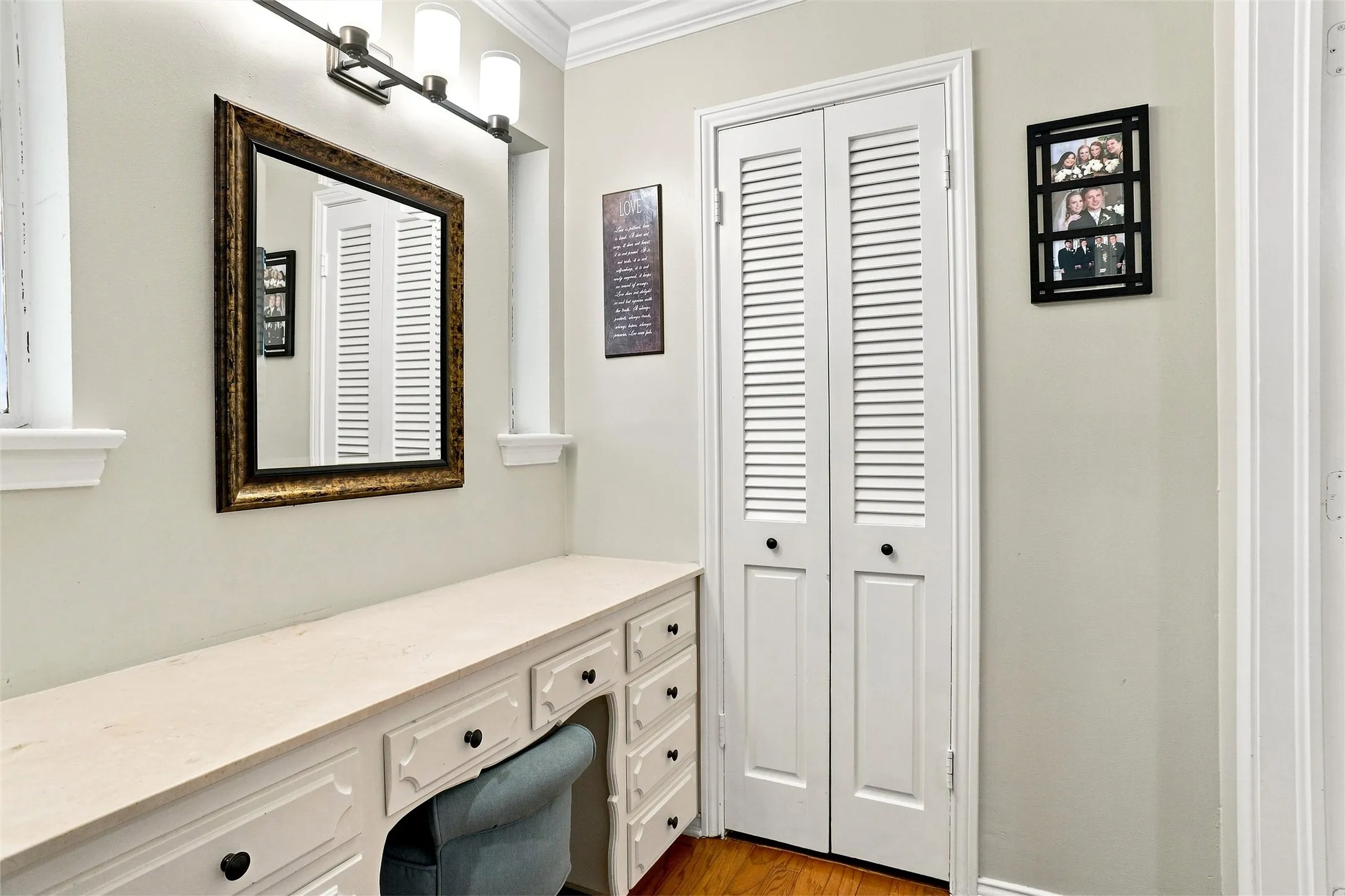 This is a separate dressing area in the primary ensuite bathroom.  The walk-in closet is through the doors pictured.