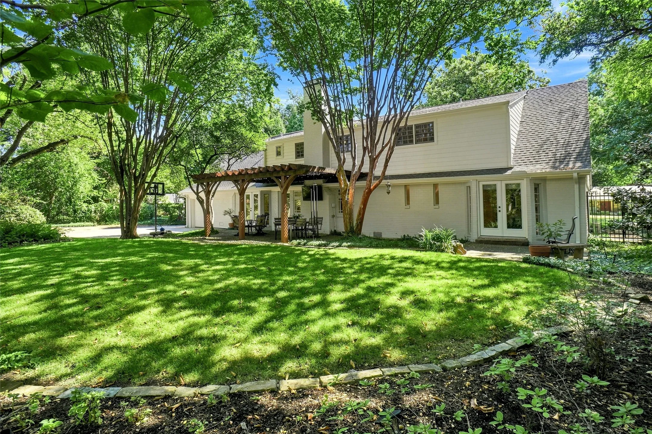 The rear of the home is quite lovely and so very well groomed. Room for entertaining, the kids, the dogs, or just a peacefull place to unwind and enjoy!