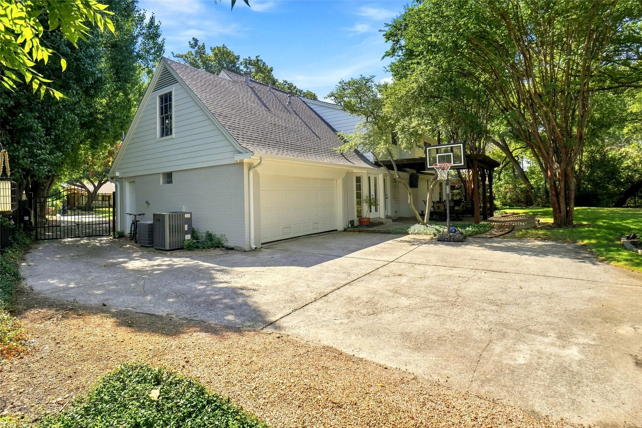 There is plenty of extra driveway and parking space...or a basketball court as currently used.   There is a newer garage door and garage door opener.  Not just a house... this is someplace very special... A very well loved​​‌​​​​‌​​‌‌​‌‌​​​‌‌​‌​‌​‌​​​‌​​ home!