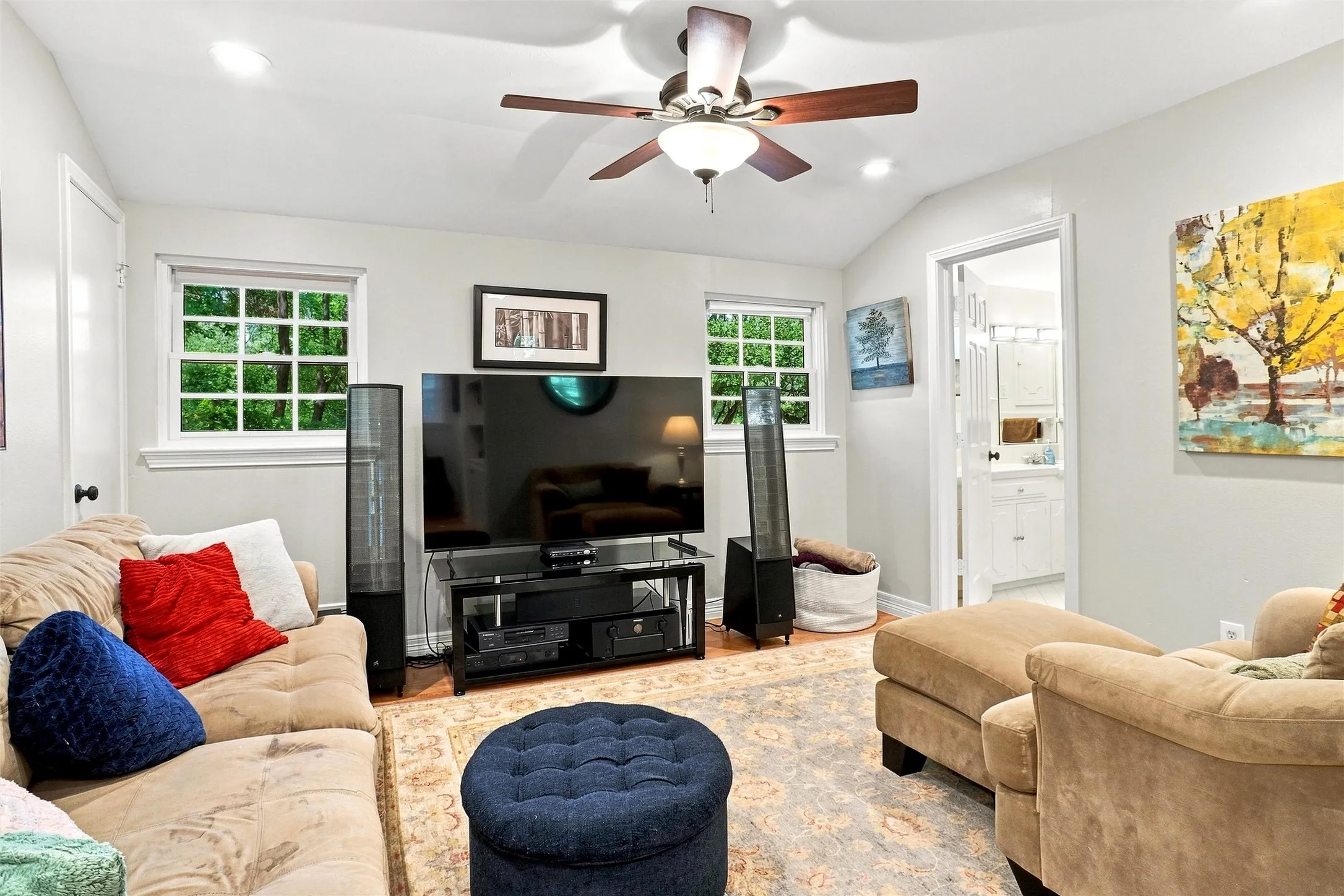 Here is looking at the other side of the game room towards the rear of the home. The door to the right goes to a full bath.  Ceiling fan, LED lights, and a very warm relaxing room.