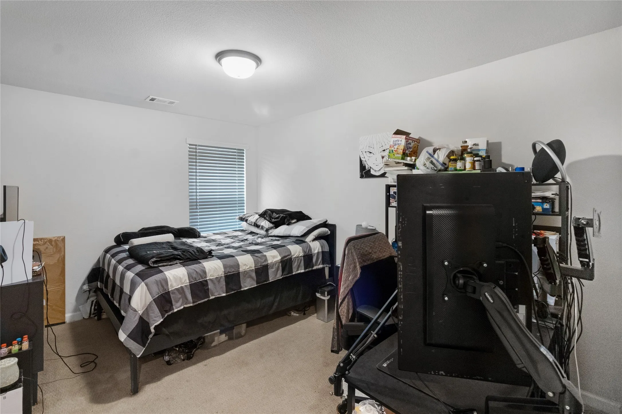 Recessed lighting, window with blinds, and carpeted flooring