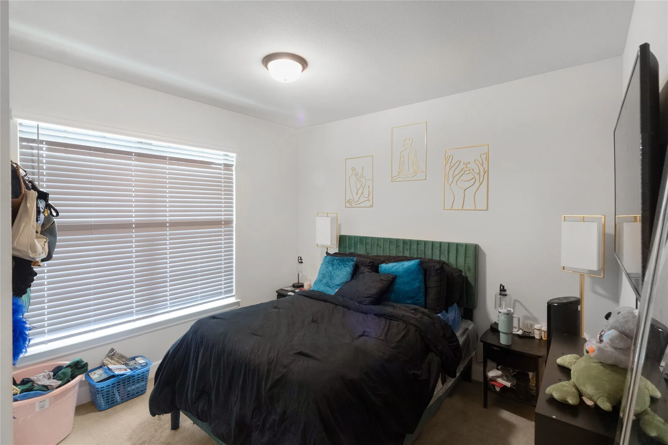 Recessed window with horizontal blinds, neutral wall paint, and overhead flush-mount lighting