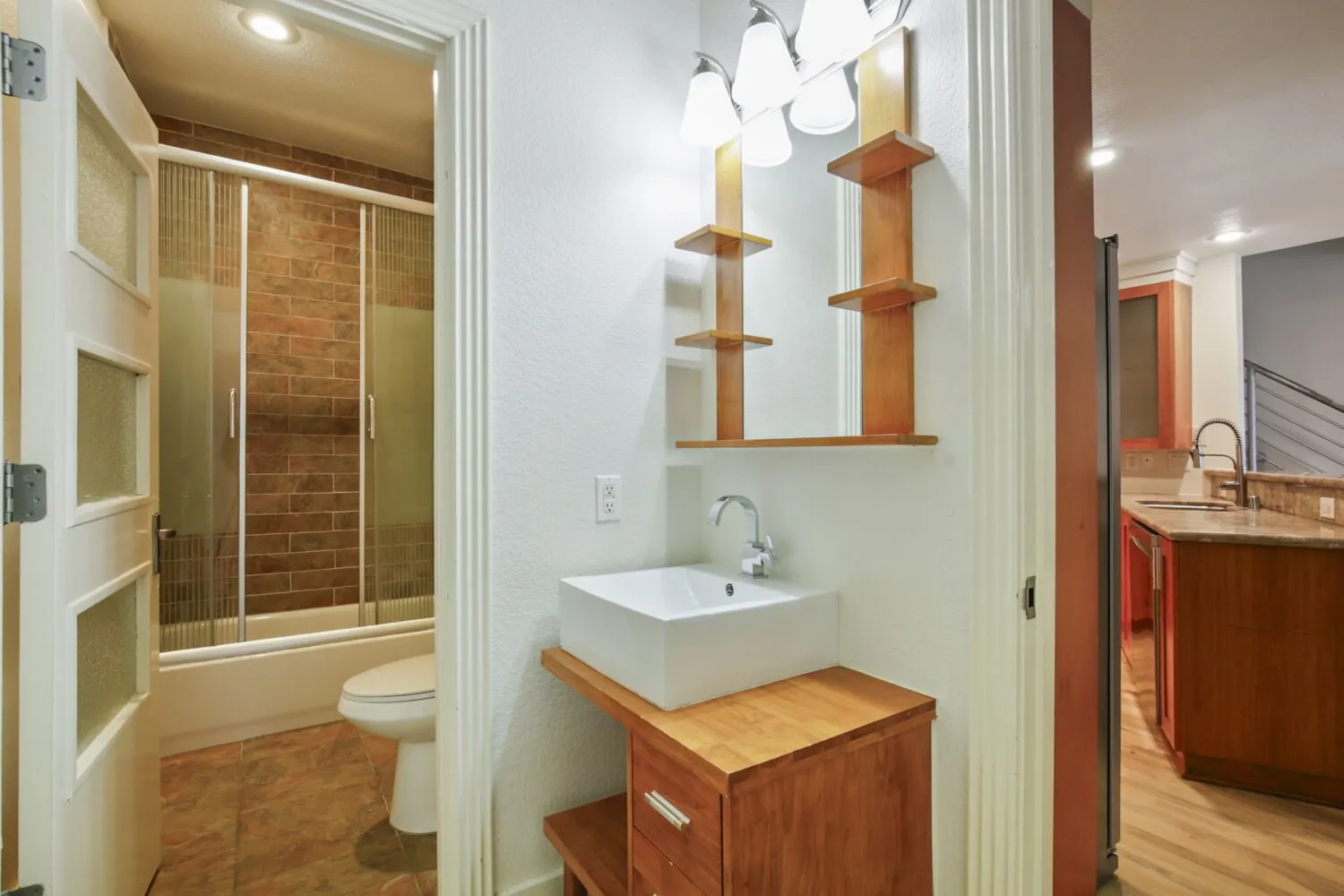 White rectangular vessel sink with chrome faucet