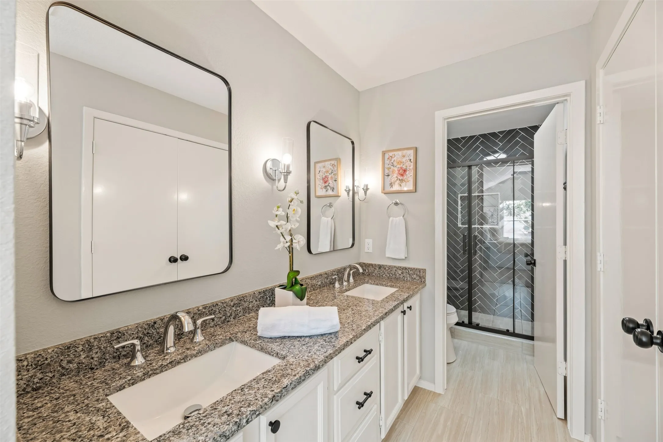 Primary Vanity has dual sinks and new granite and faucets