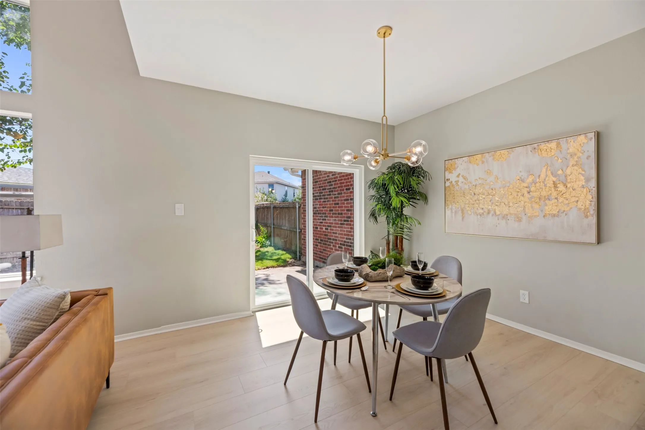 Dining space with new chandelier and patio door