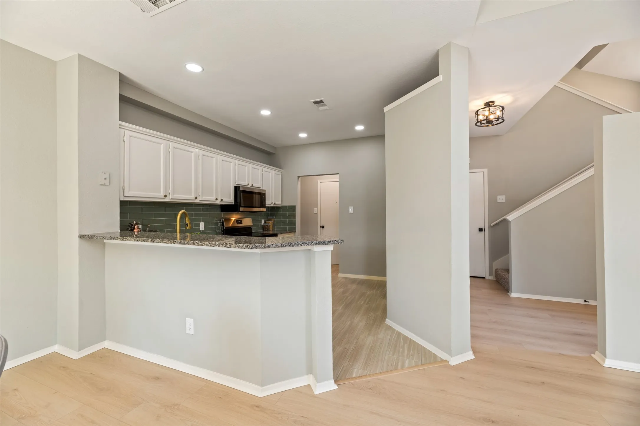 Breakfast bar off of kitchen is perfect for quick meals