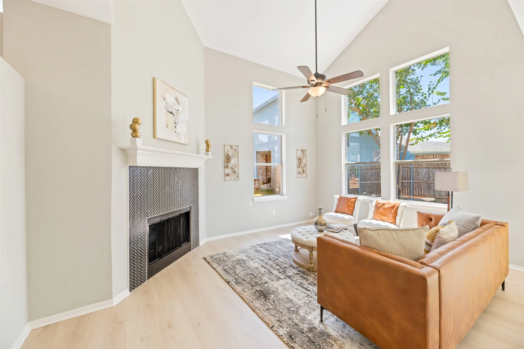 Living Room with tall ceilings and large windows providing plenty of natural light