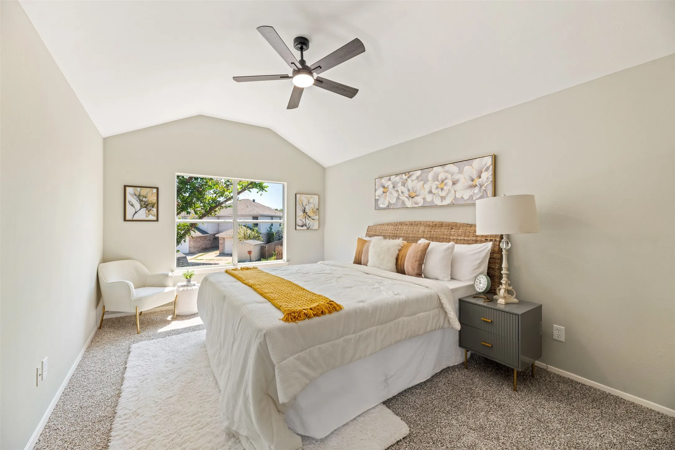 Spacious primary bedroom.  All bedrooms have new carpet and ceiling fans.