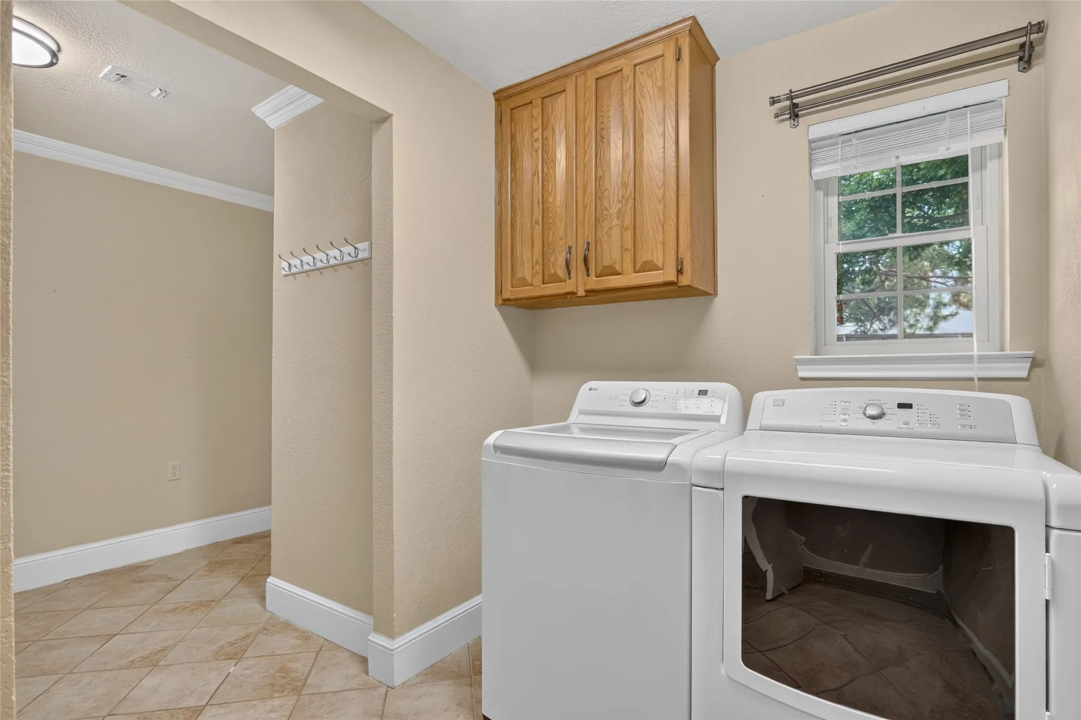 Laundry with bonus room perfect for second fridge