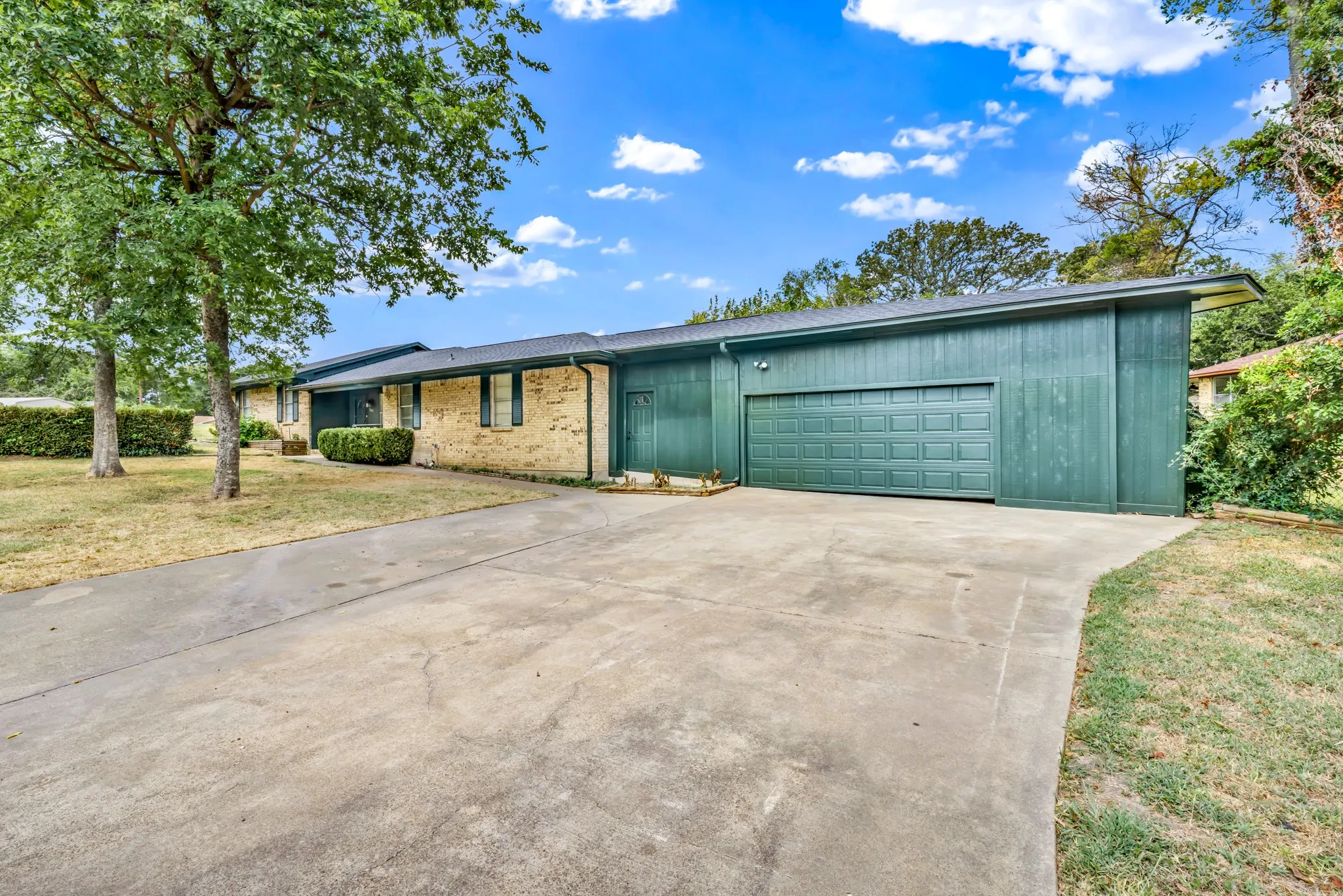 from the spacious driveway offering multiple parking options