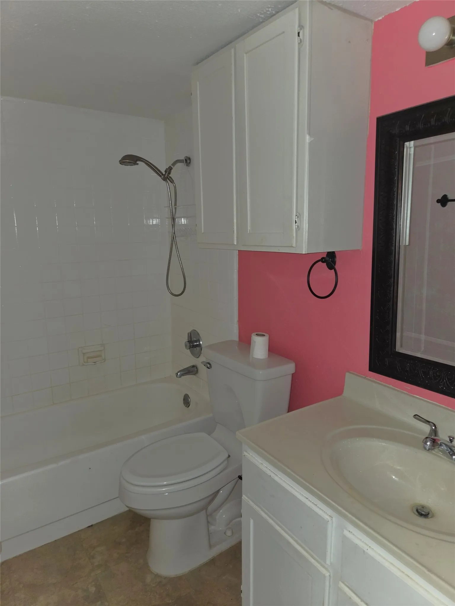 Bathroom has a linen cabinet