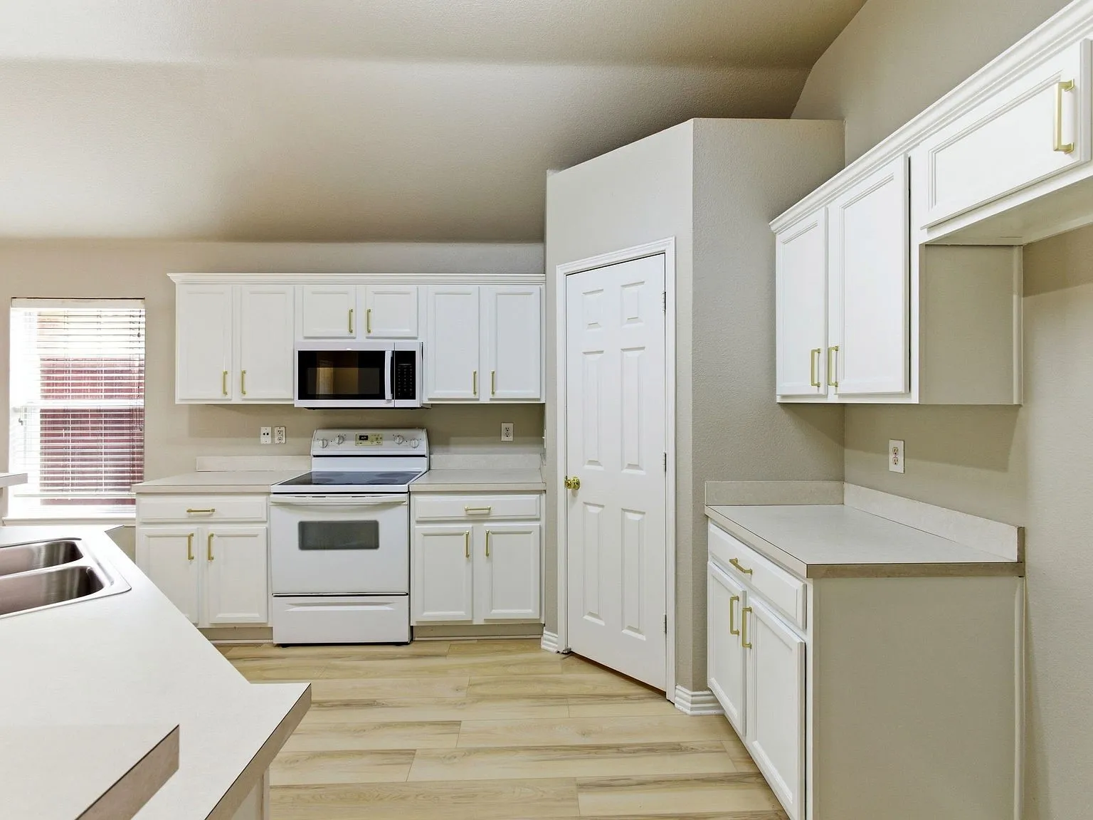 White cabinetry with gold-tone hardware