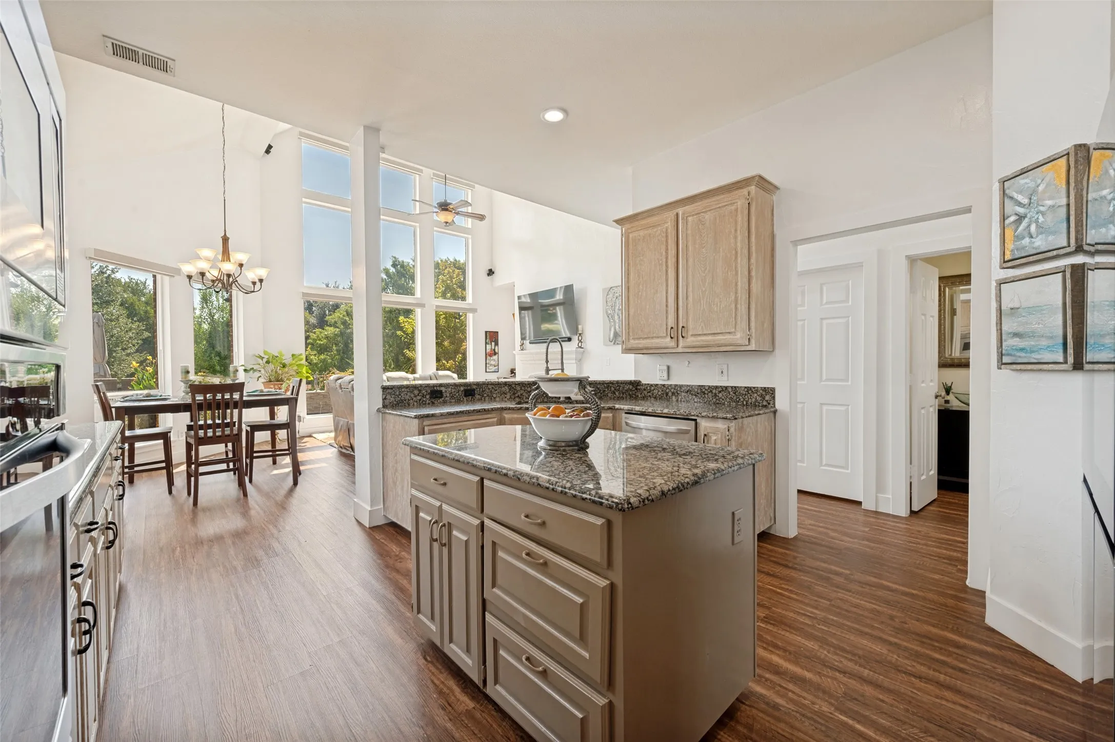 Kitchen featuring a central island with storage, and granite countertops