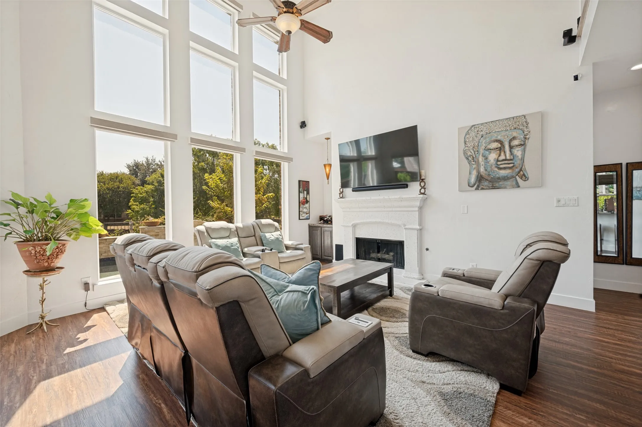 Floor to ceiling wall of windows with remote controlled shades