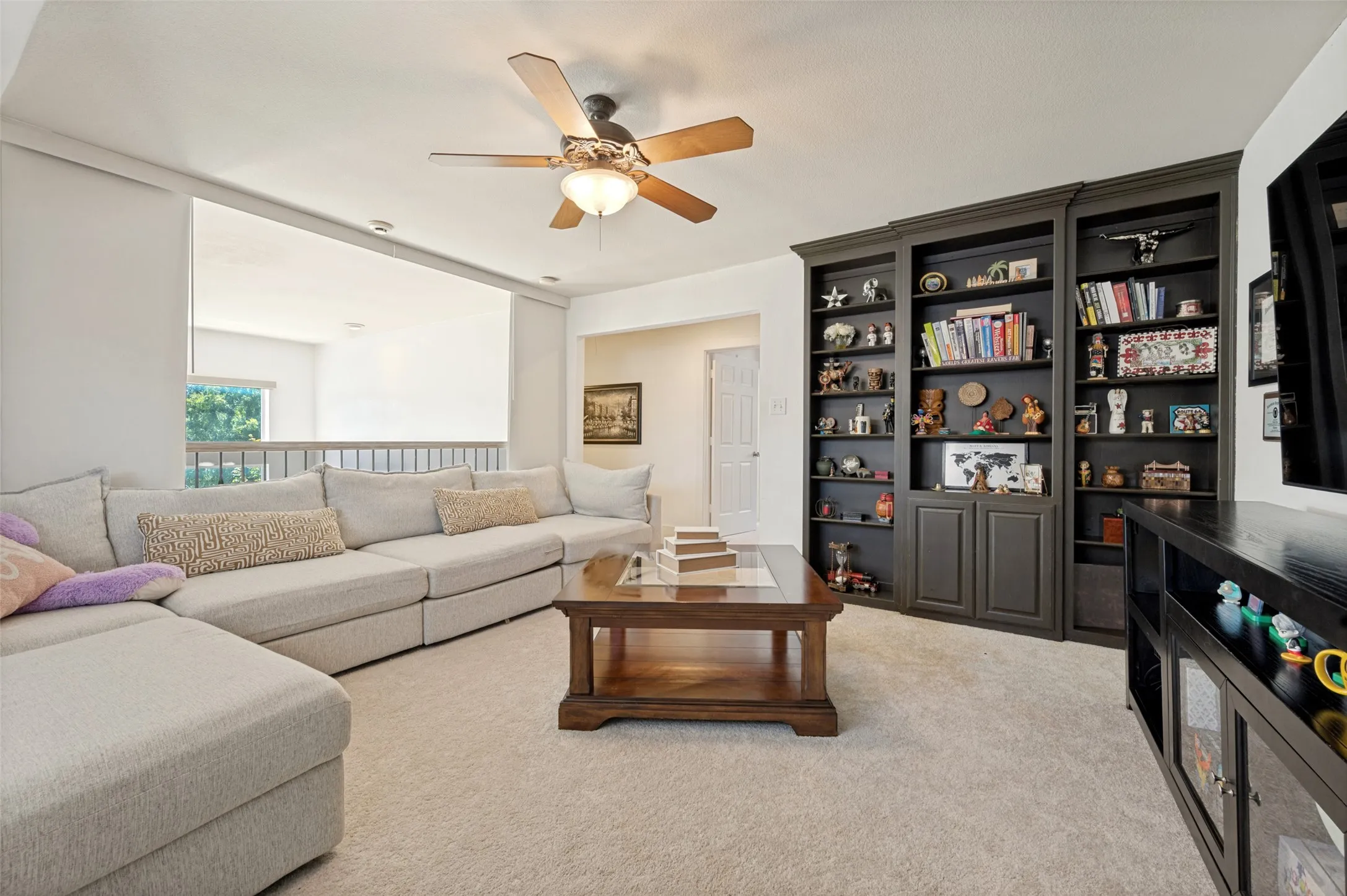 Another view of the gameroom with built in shelves