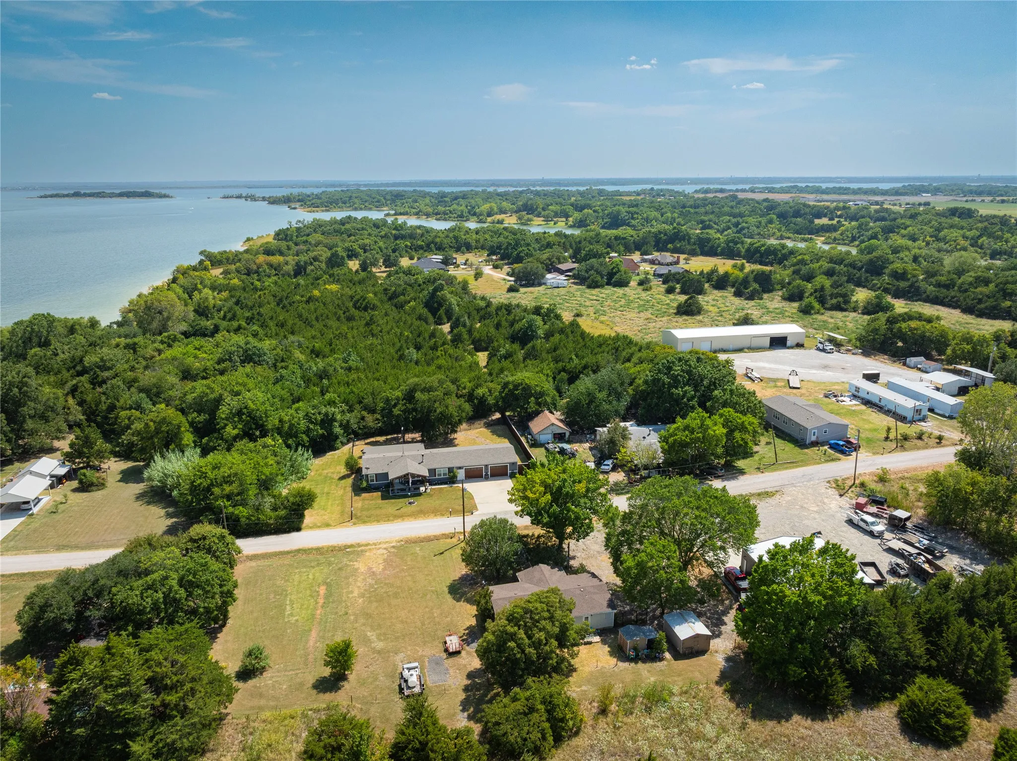 Expansive land offering diverse terrain, mature trees, and waterfront proximity
