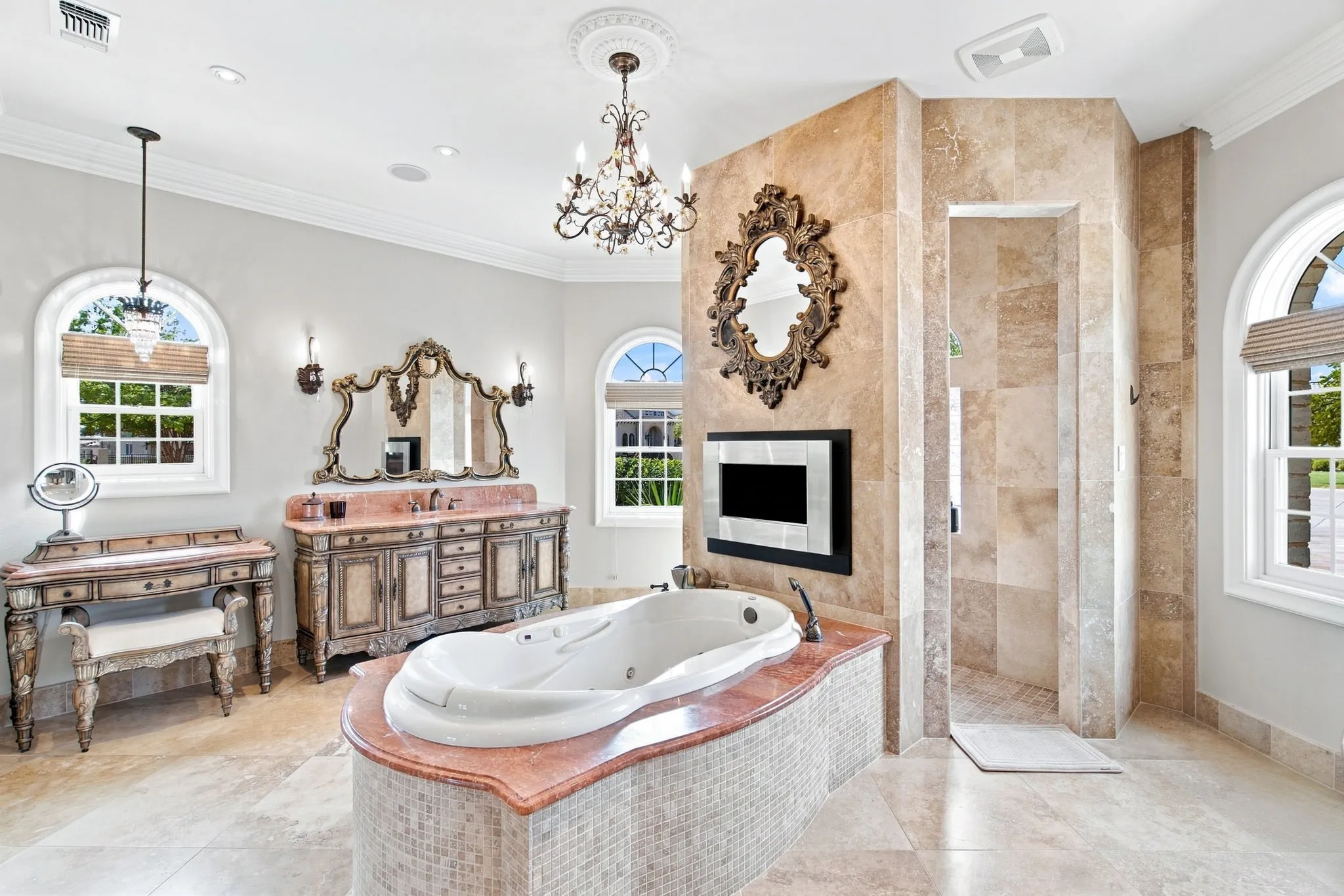 Freestanding jetted bathtub with a mosaic tile surround and red countertop