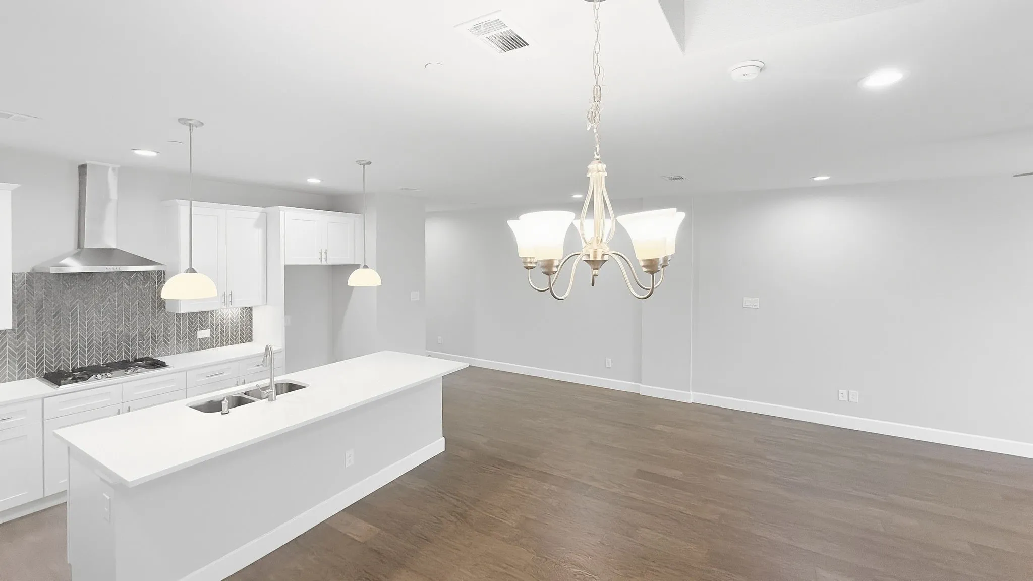 Open-concept layout featuring wood-finish flooring
