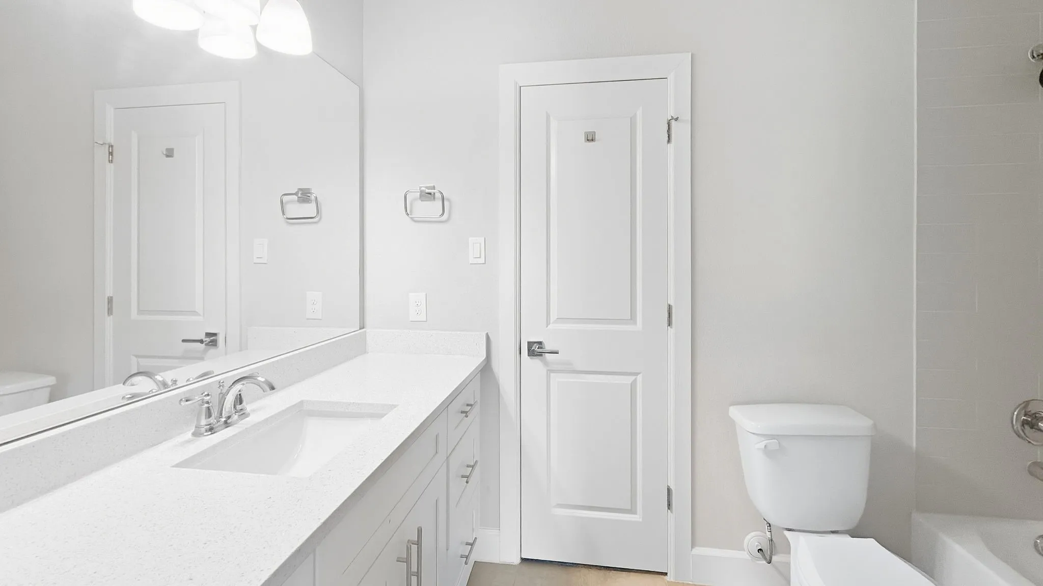 Expansive vanity with an integrated sink, polished chrome faucet, and generous counter space