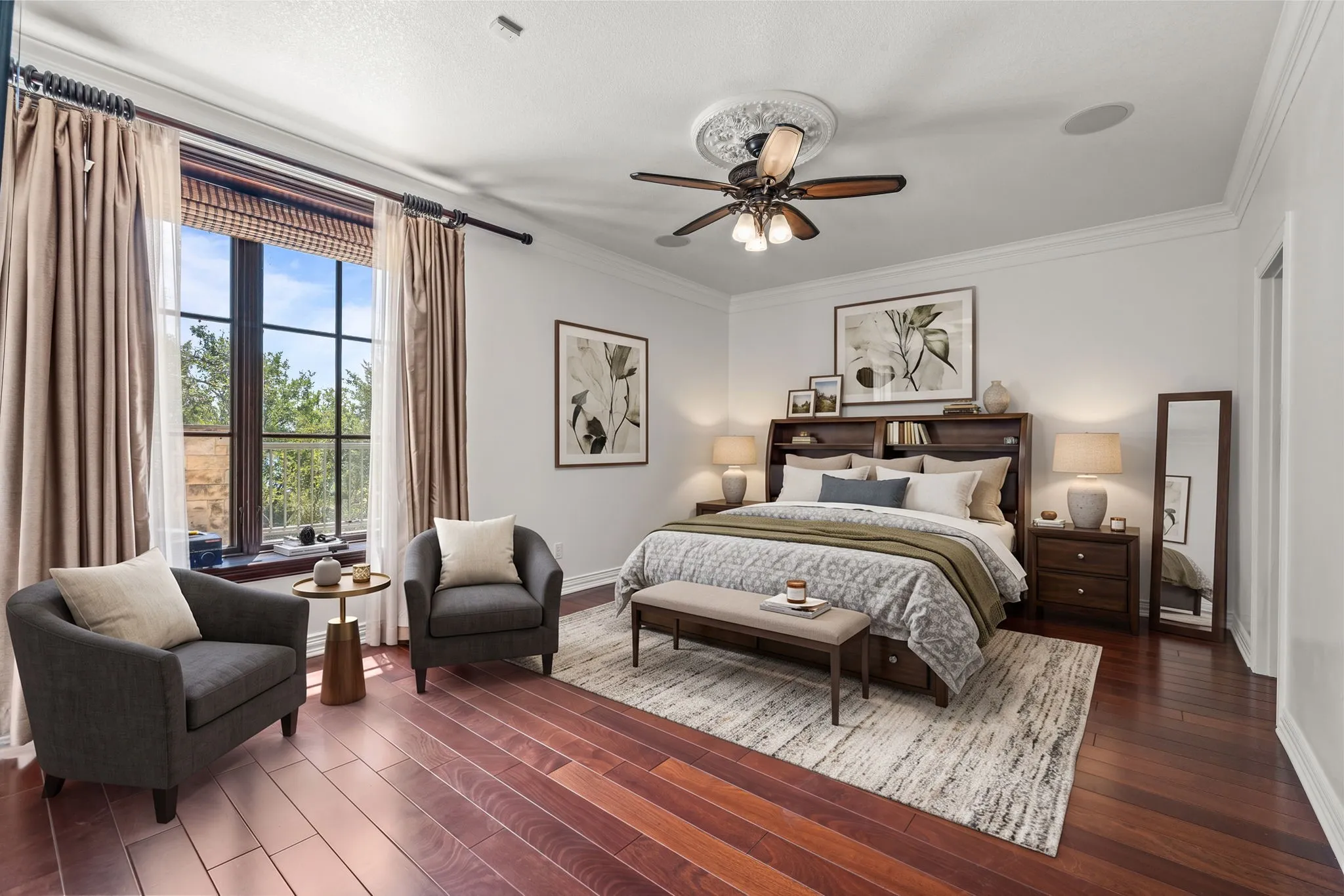 Wood-finish flooring, crown molding, a ceiling fan with decorative medallion, recessed lighting, and large multi-pane windows-Staged