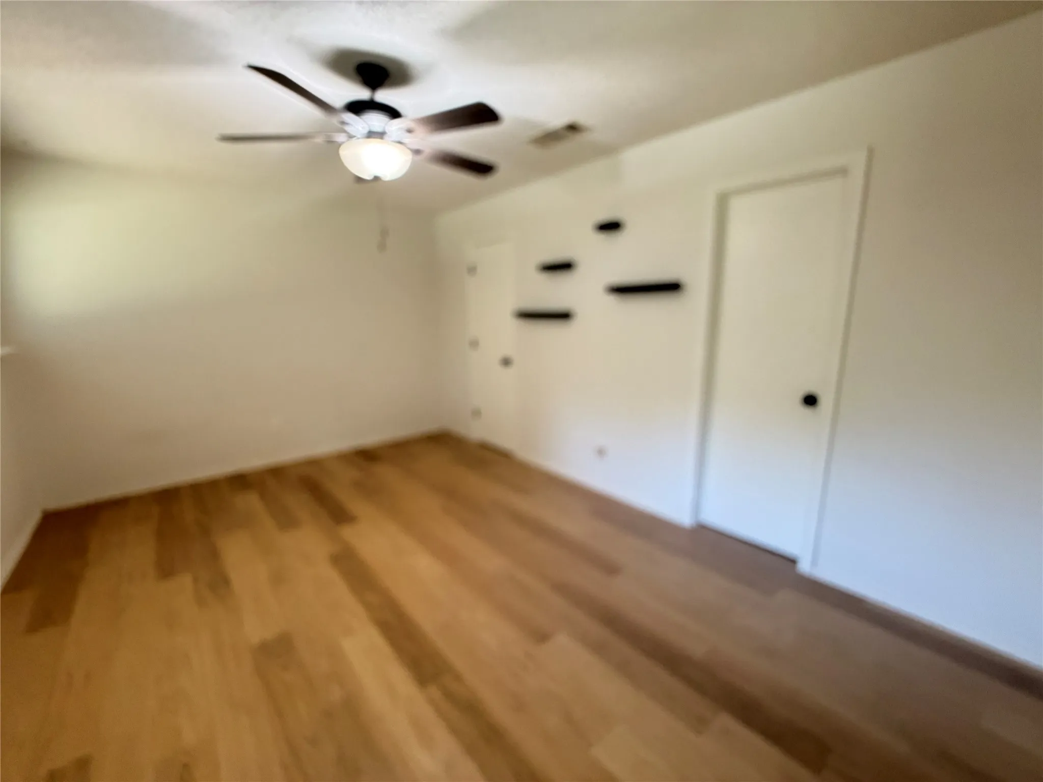Wood-finish flooring with white walls