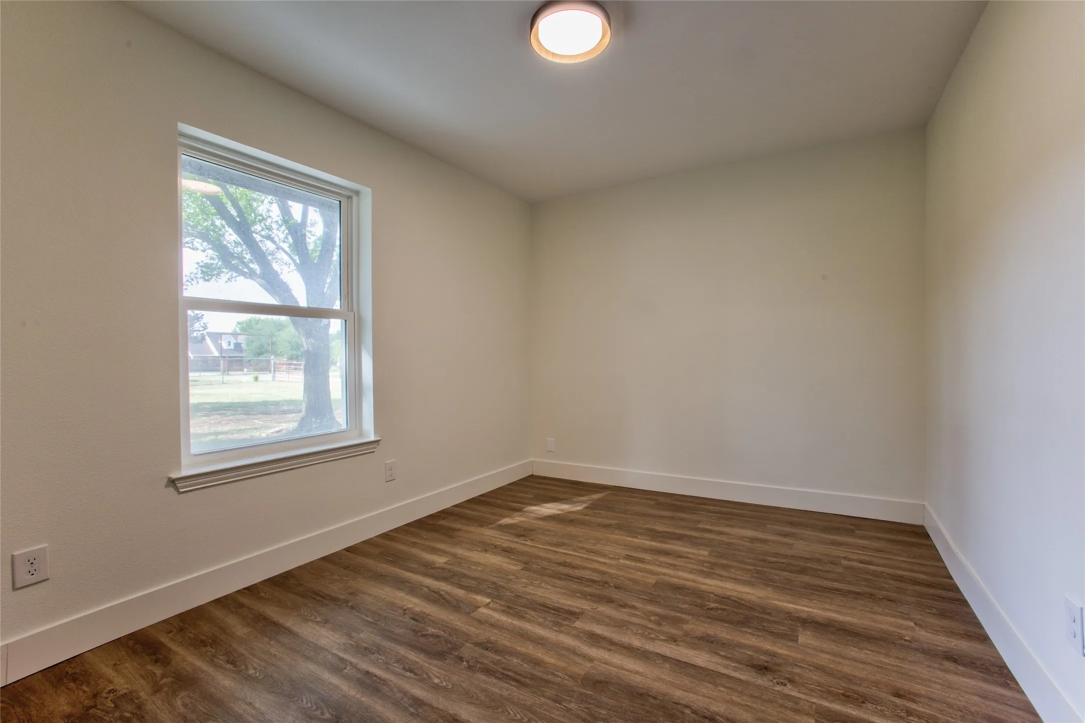 View #1 Into #1 Bedroom Or Home Office wNew Recessed  Light, LVP Flooring Thoughout