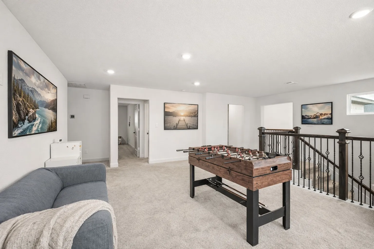 Rec room with light carpet and recessed lighting