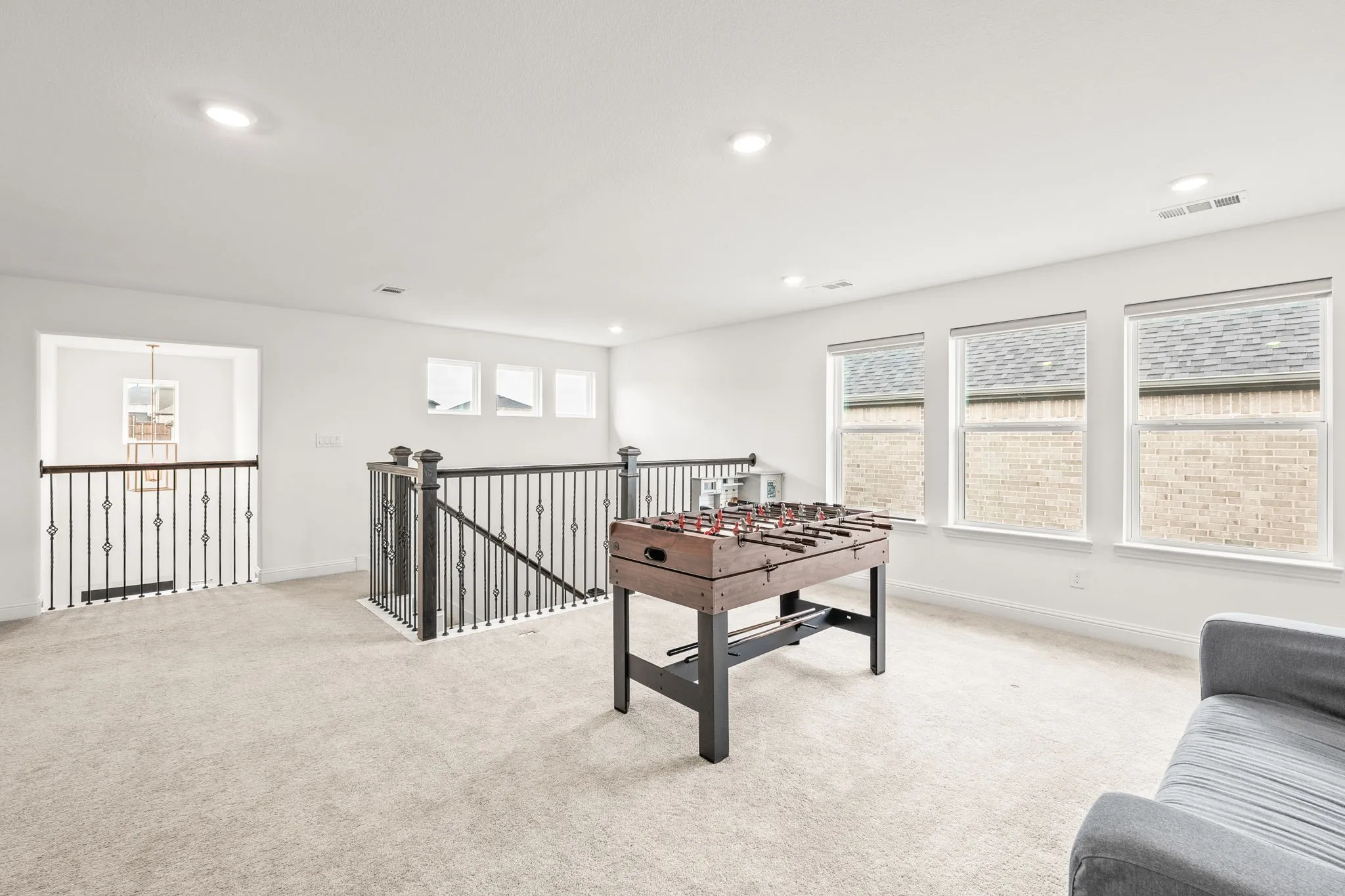 Playroom with light colored carpet and recessed lighting
