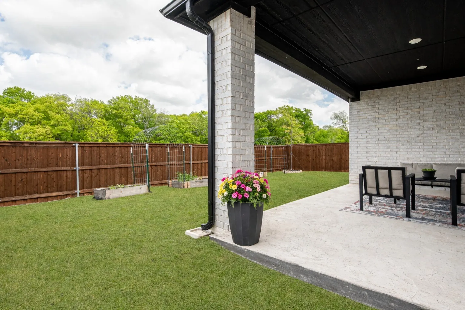 Fenced backyard featuring a patio area