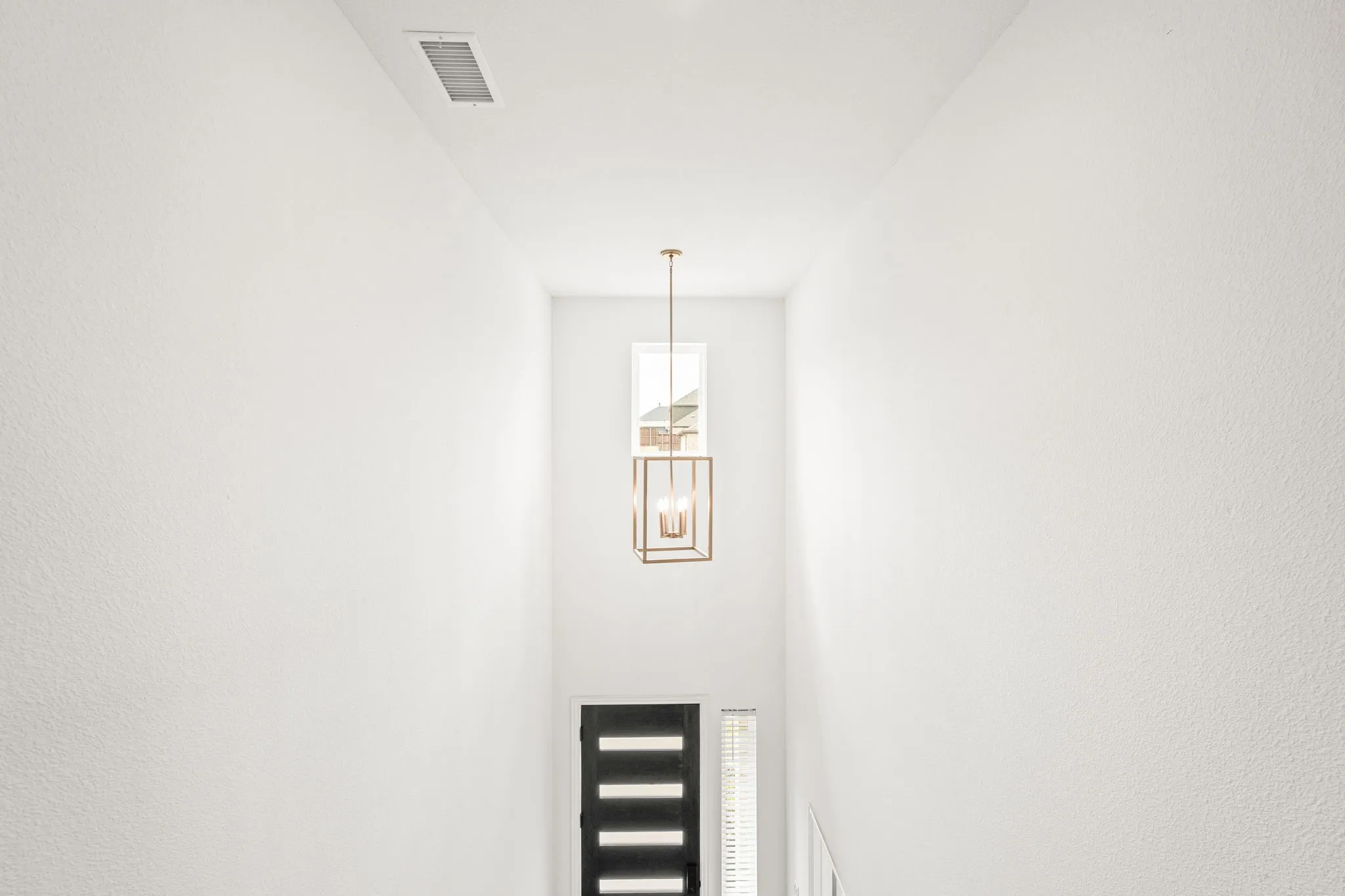 Detailed view of a chandelier and a textured wall