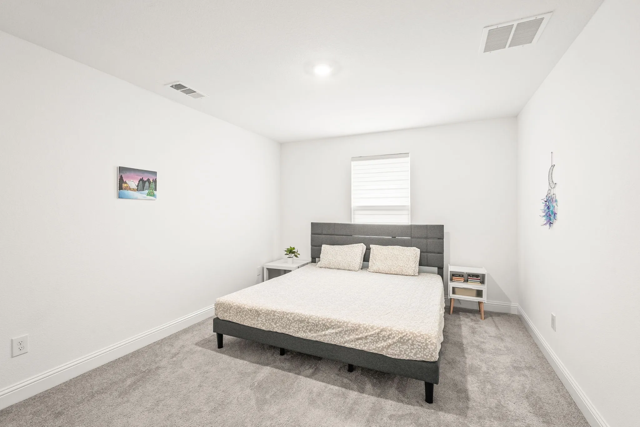 Bedroom with light carpet