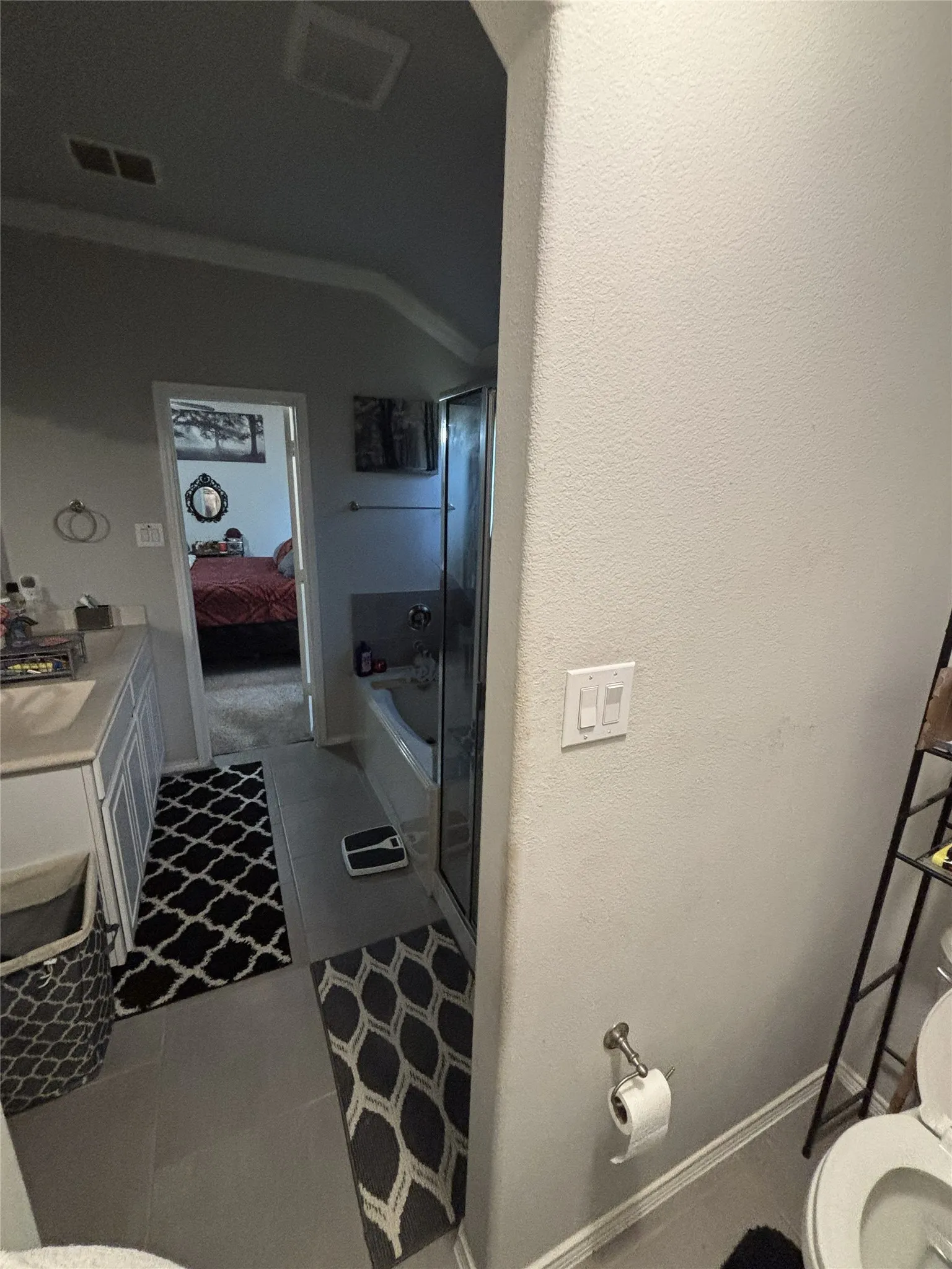 White vanity with a neutral countertop