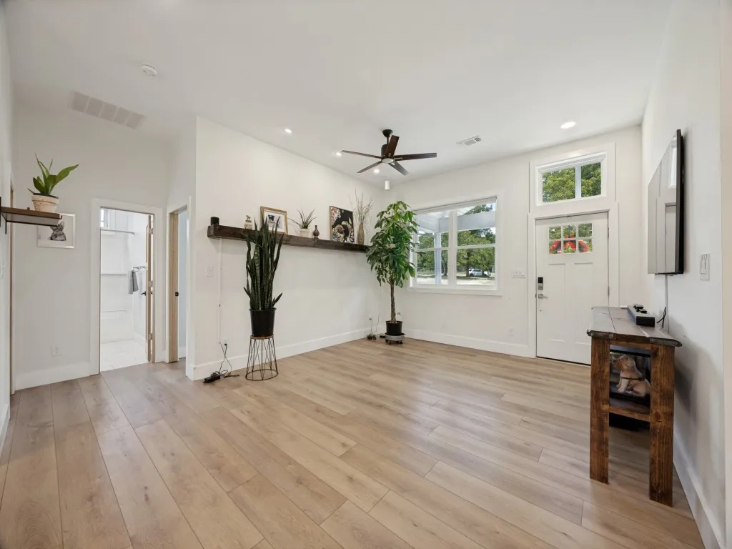 Another view of the living room with two guest bedrooms and bathroom