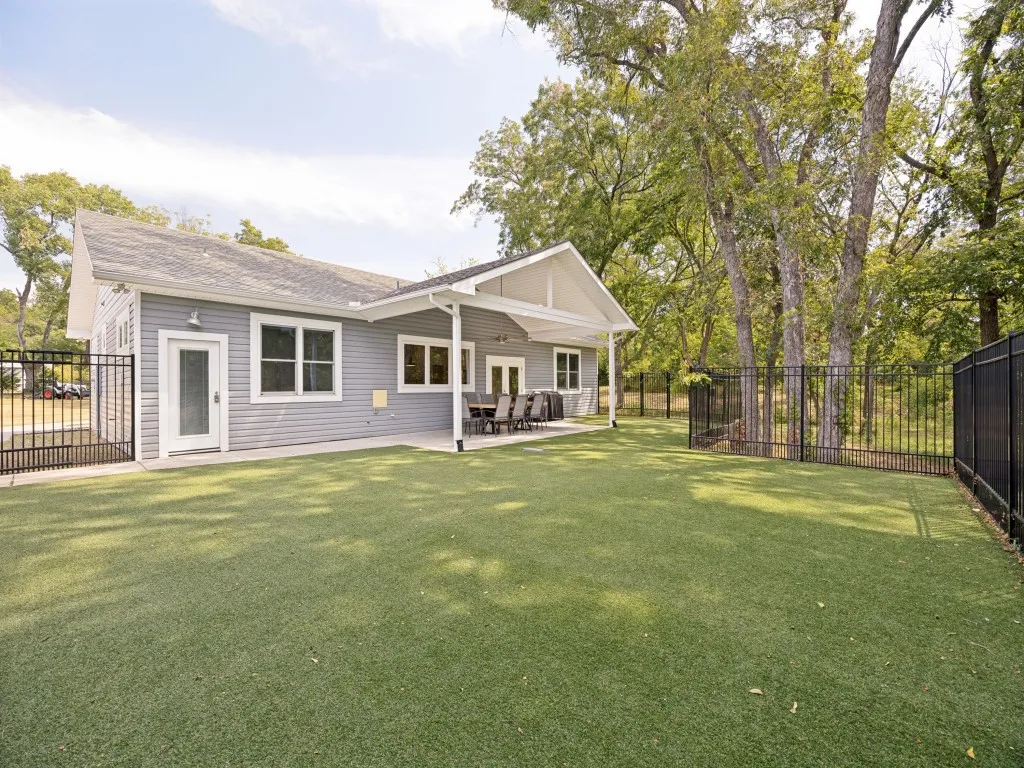 Artificial turf, trees, large covered patio - yes please!