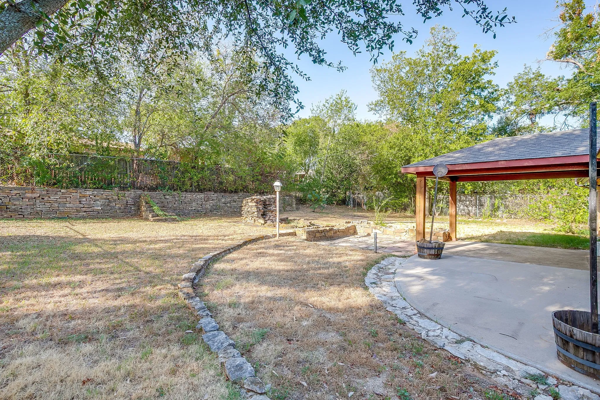 Large backyard with covered patio