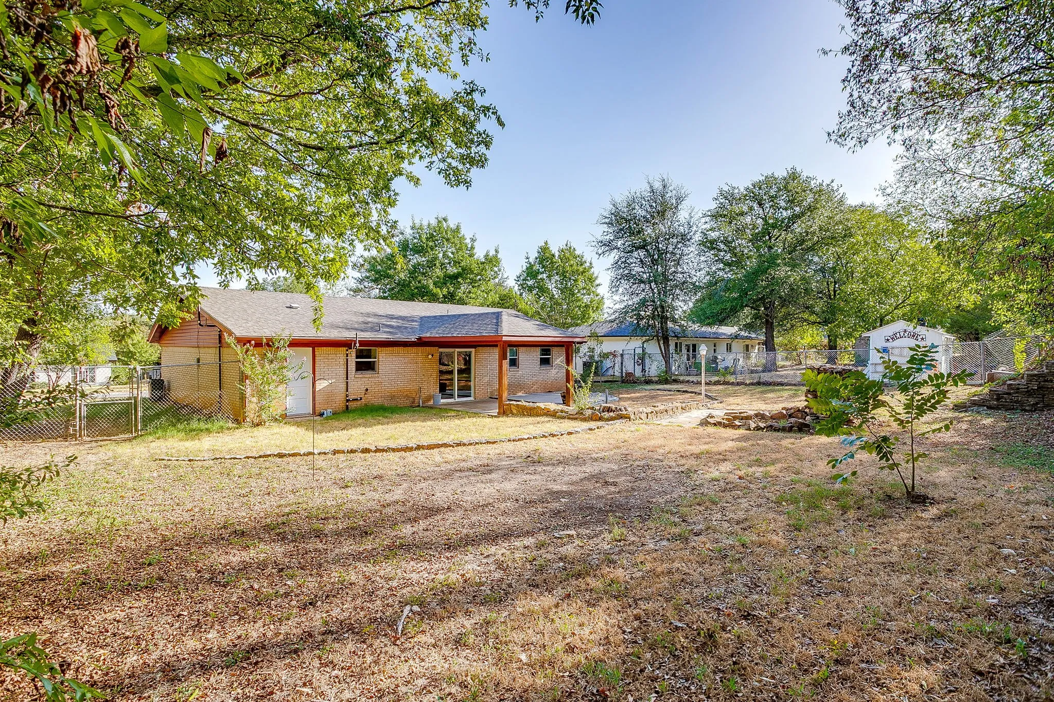 View of back yard from the rear fence line