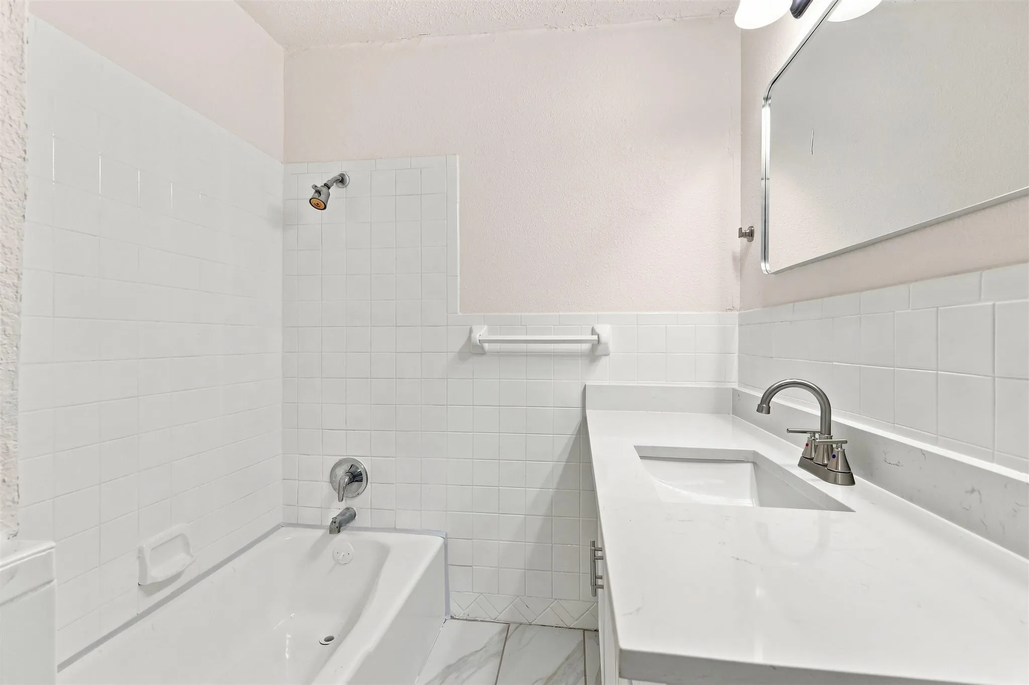 White subway tile bath surround