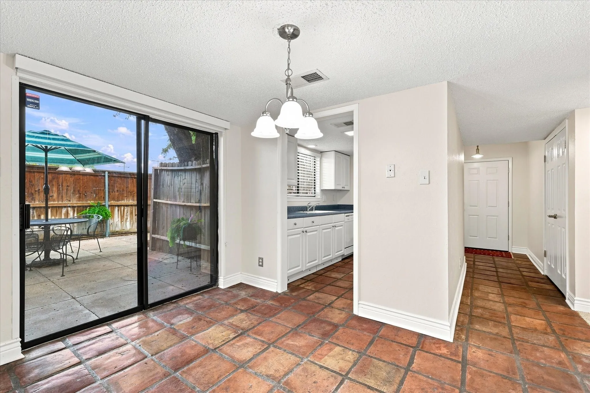 Saltillo tile and freshly painted walls are the perfect canvas to make this home your own