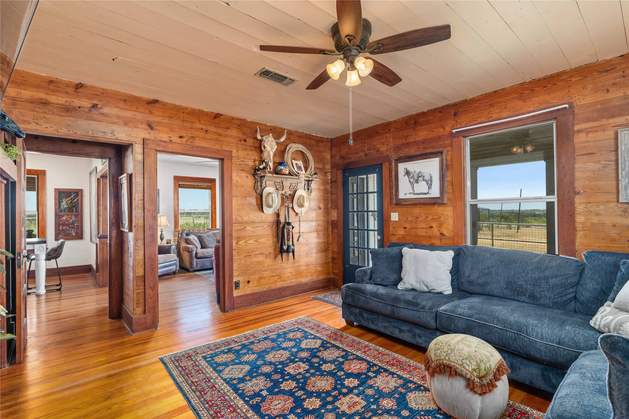 Second living room with original ship lap walls and original hardwood floors