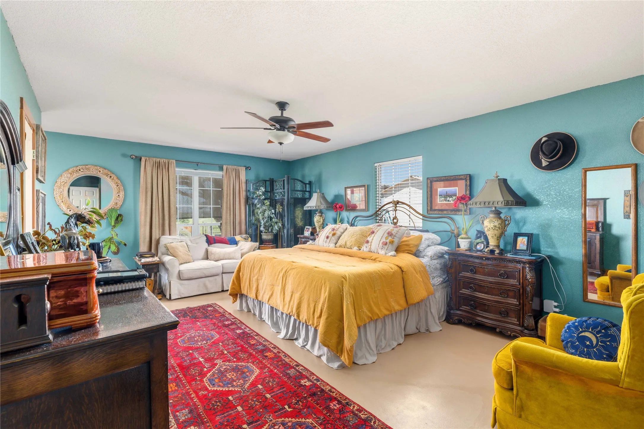 Primary bedroom with a sitting area