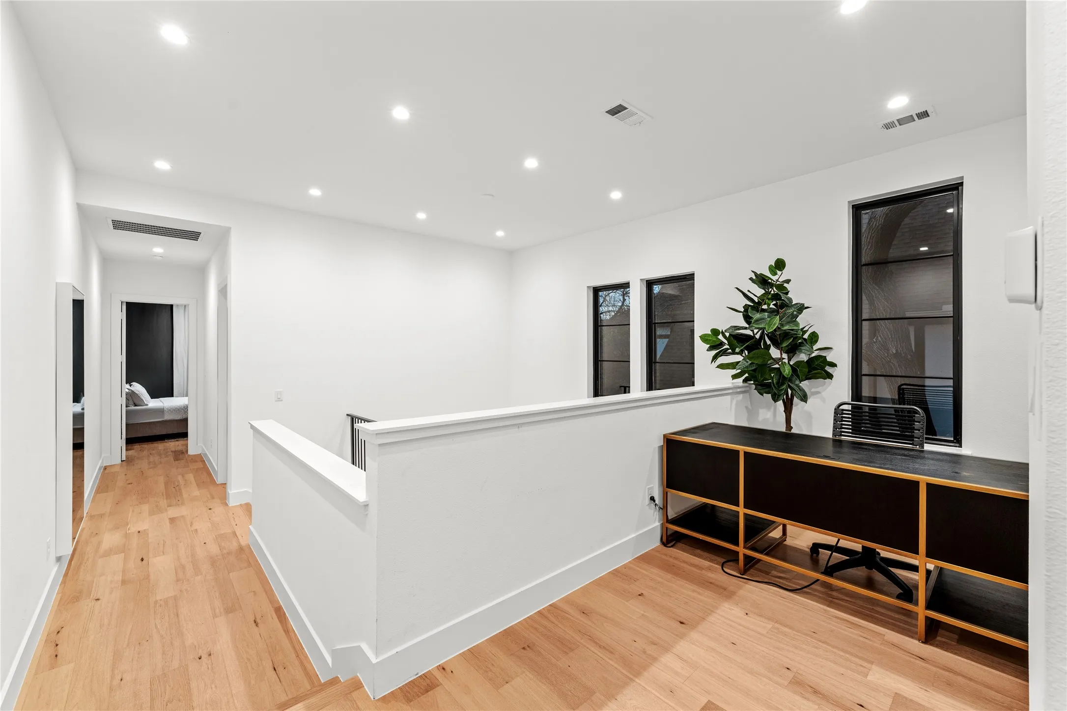 Nook at top of stairs is perfect for home office,  tons of natural light.
