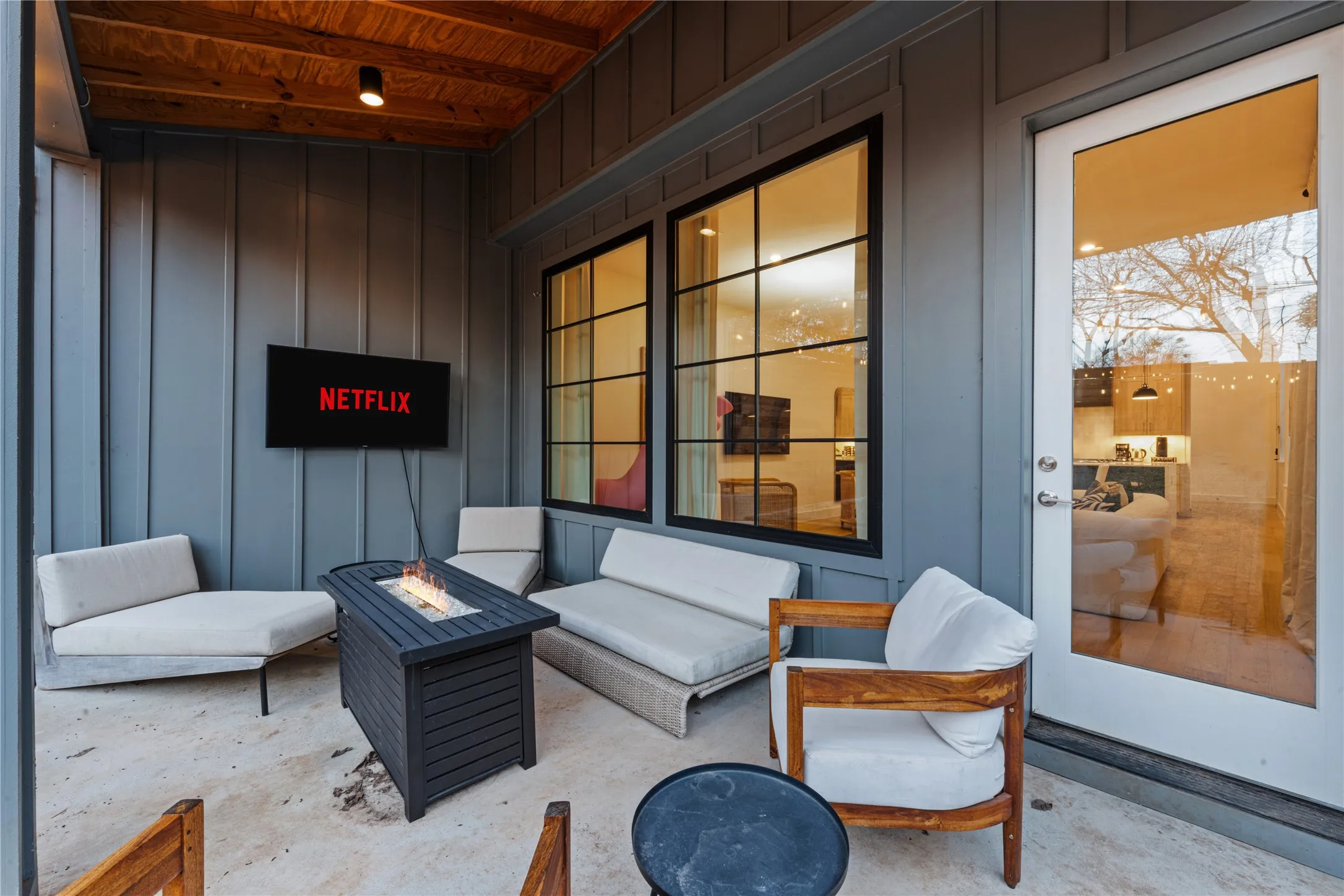 Patio featuring a wood-panel ceiling, concrete with covered porch.