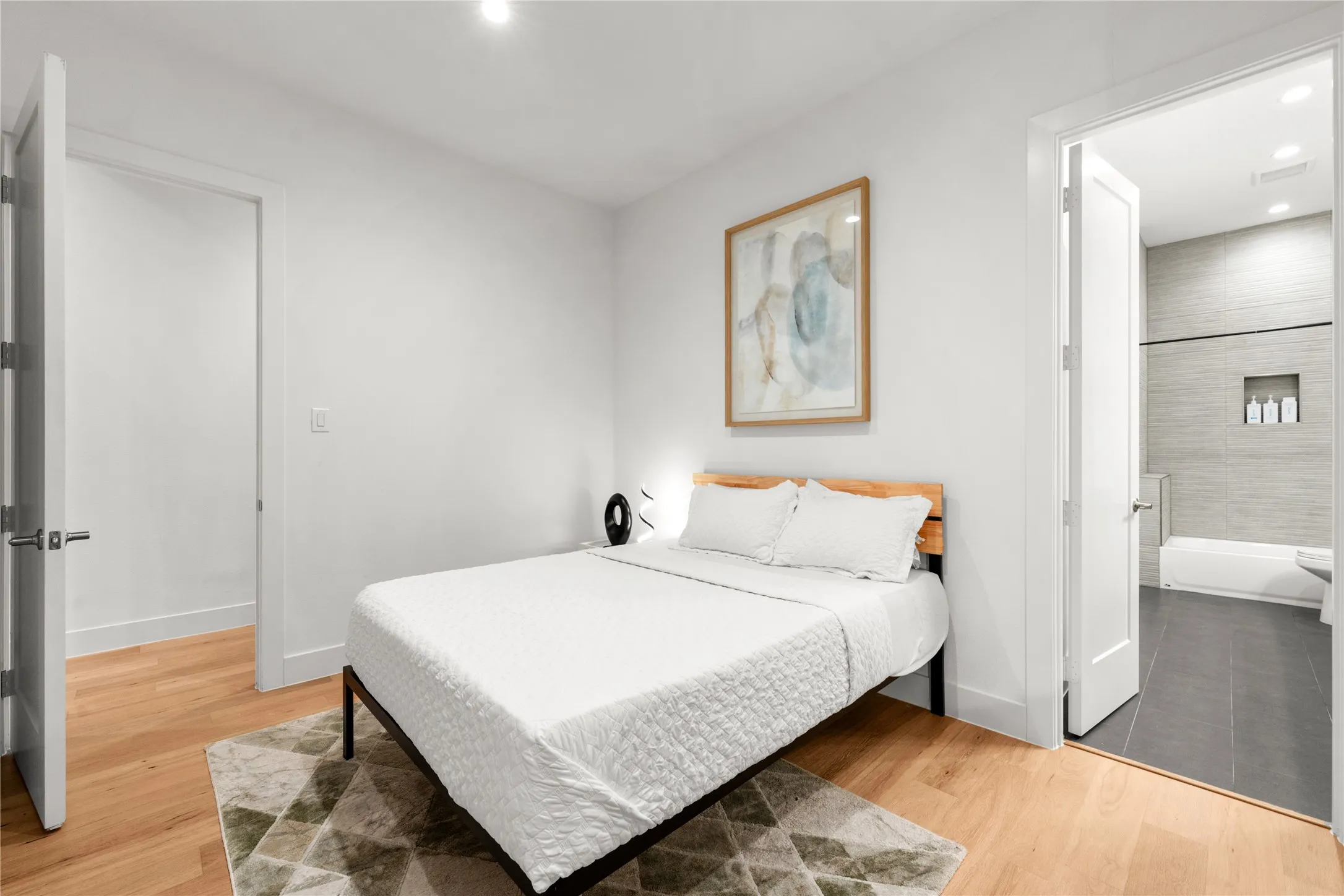 Light wood-finish flooring complements white​​‌​​​​‌​​‌‌​‌‌​​​‌‌​‌​‌​‌​​​‌​​ walls