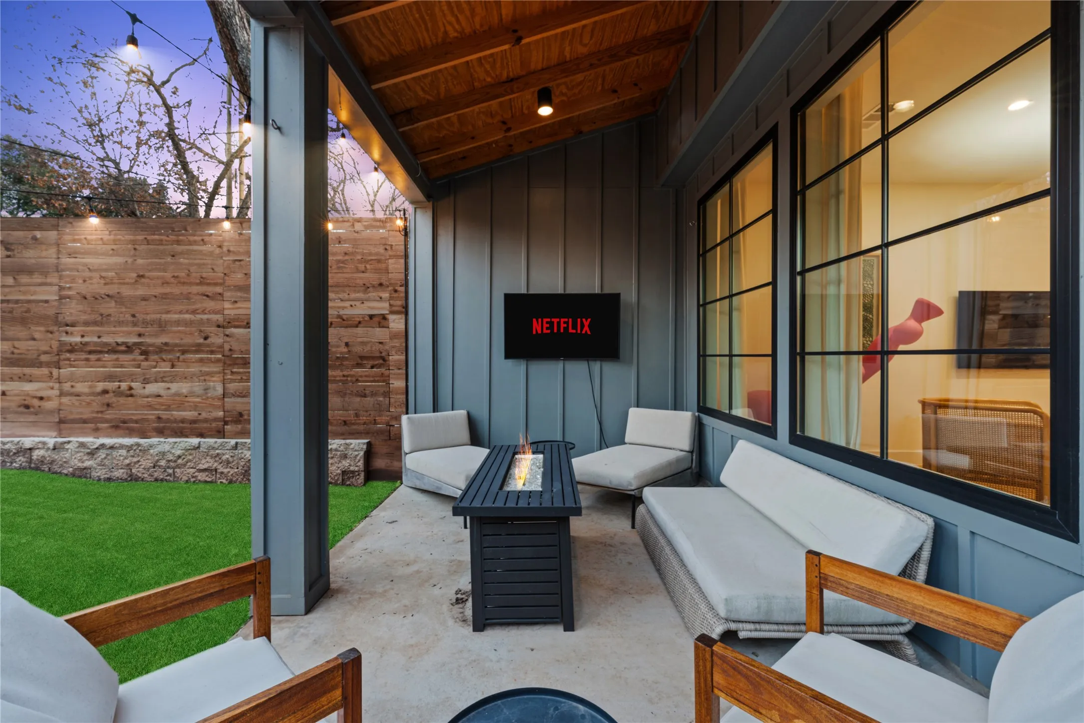 Covered patio featuring a wood plank ceiling and concrete flooring