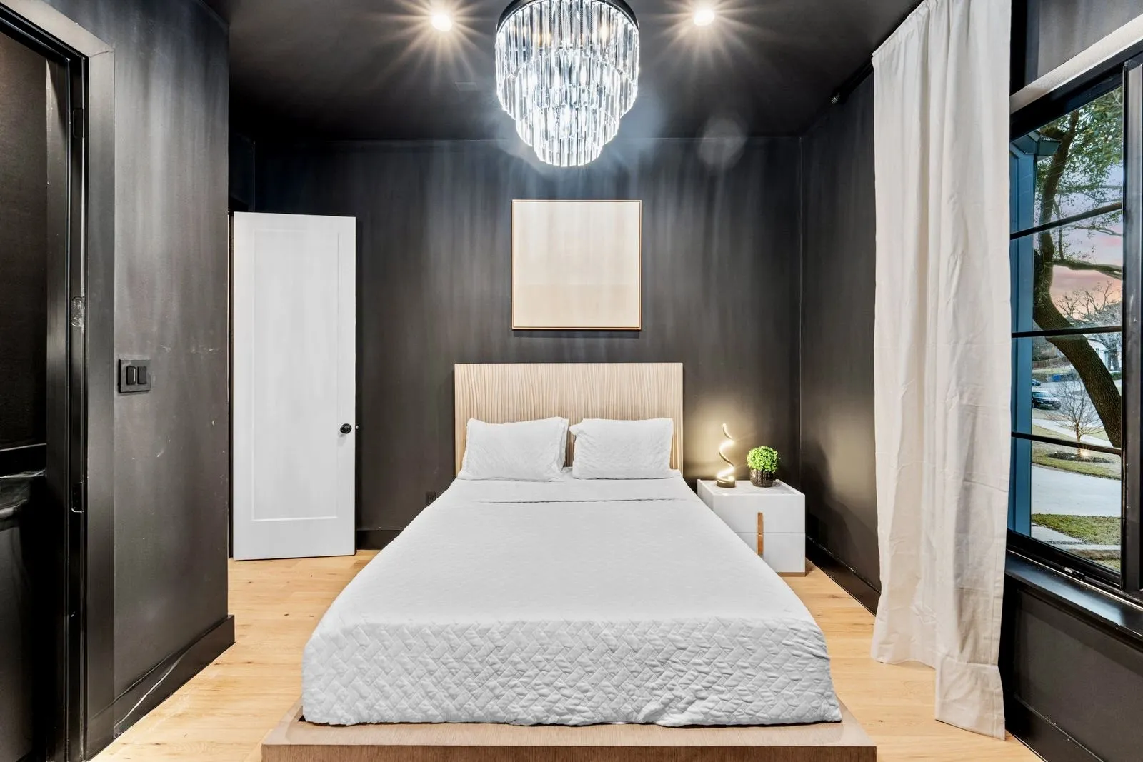 Elegant secondary bedroom with built in bar.
