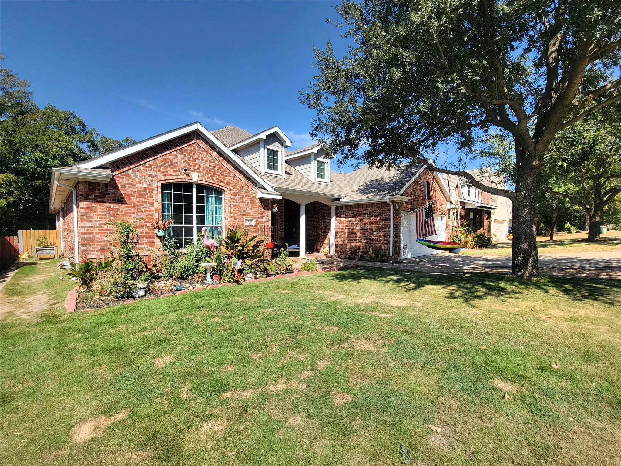 Brick exterior with gabled roofline and dormer windows