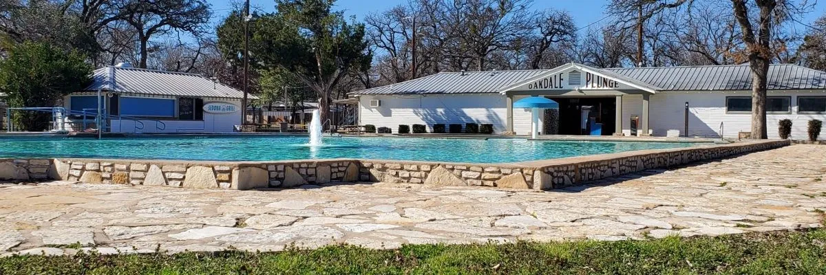 Large local pool featuring a fountain in the center. Just one city block from the home.