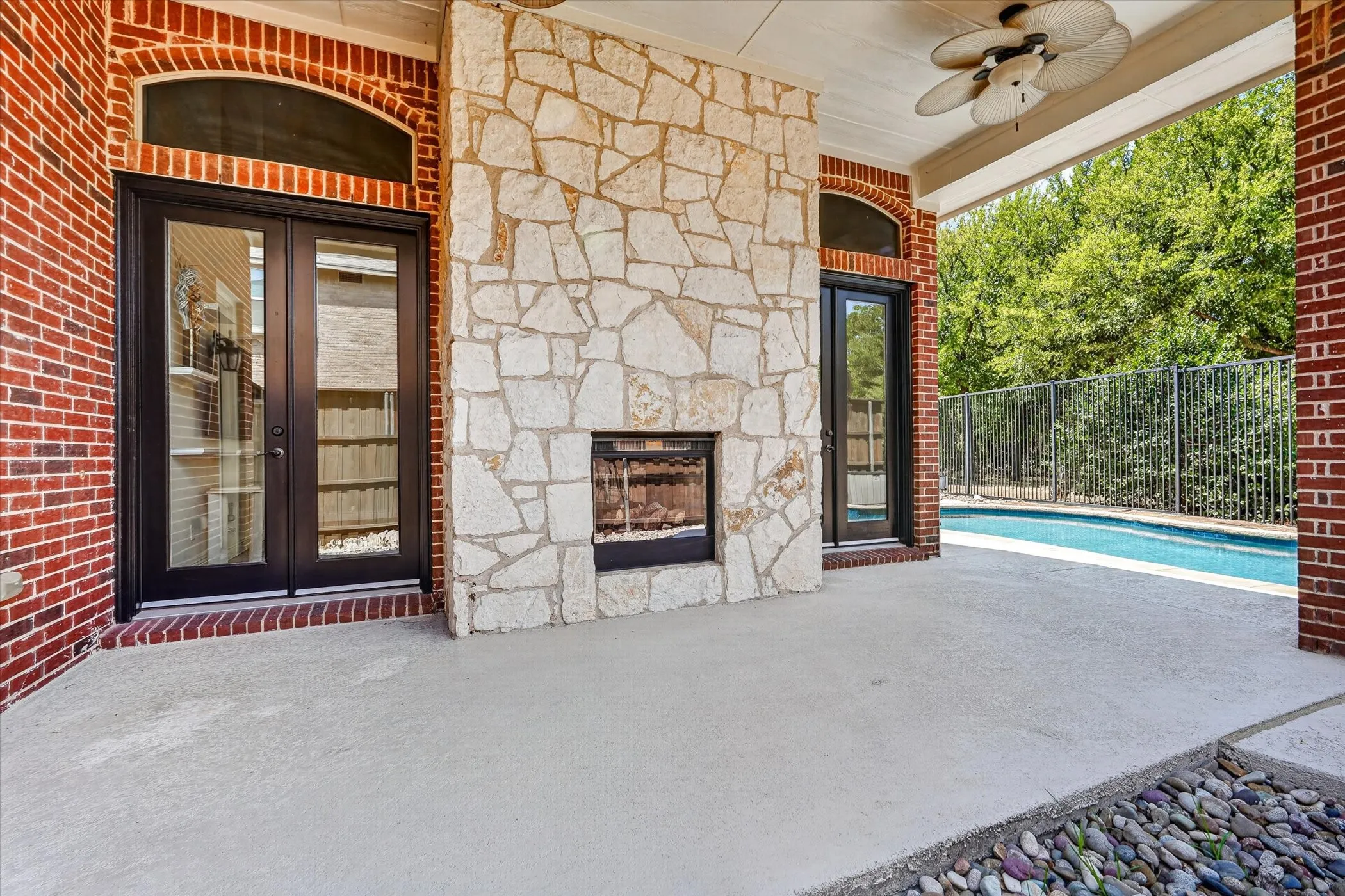 SIt on your covered patio in the cool autumn air and enjoy the heat from the two sided fireplace!