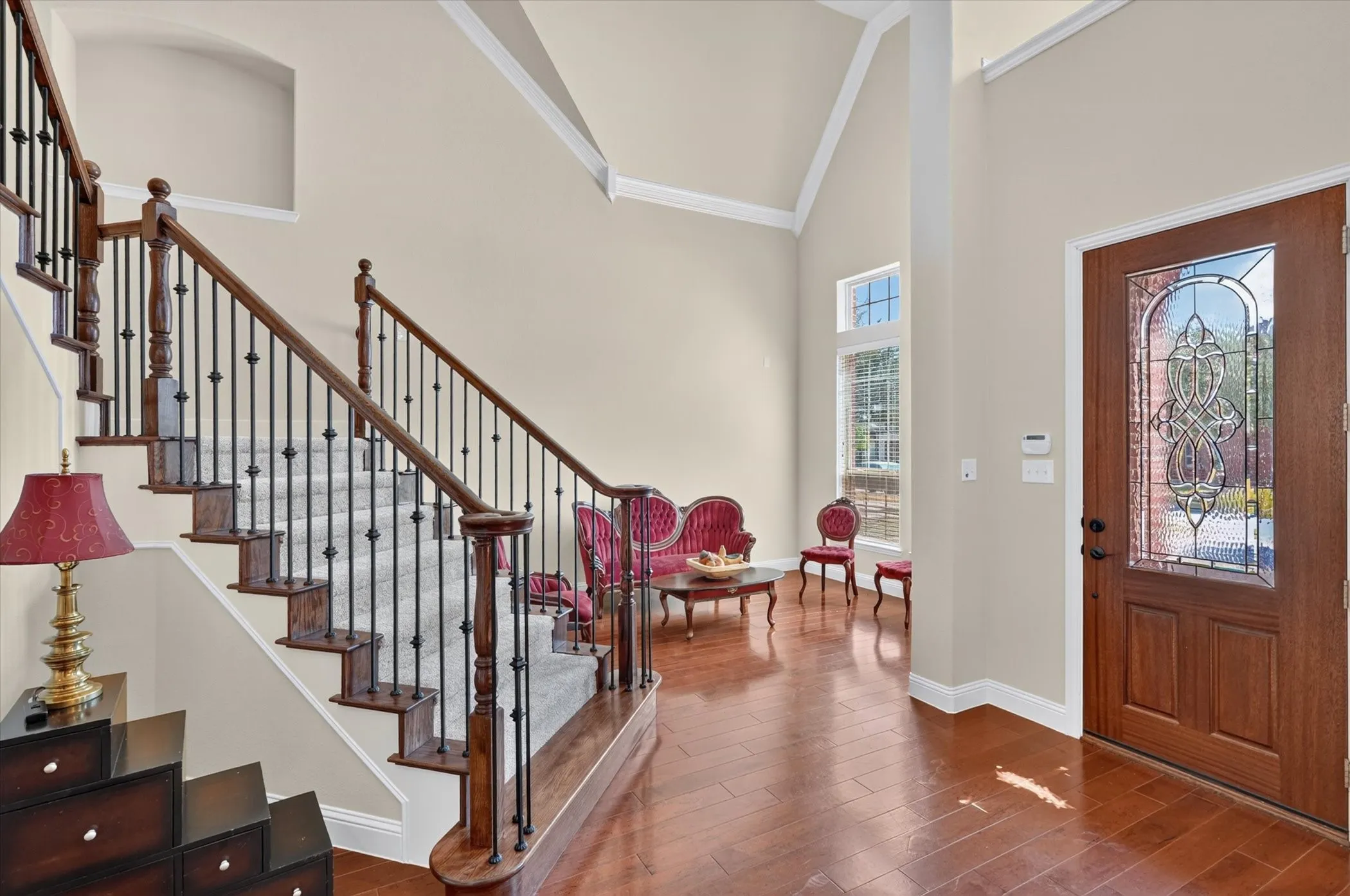 Stately staircase with wrought iron spindles